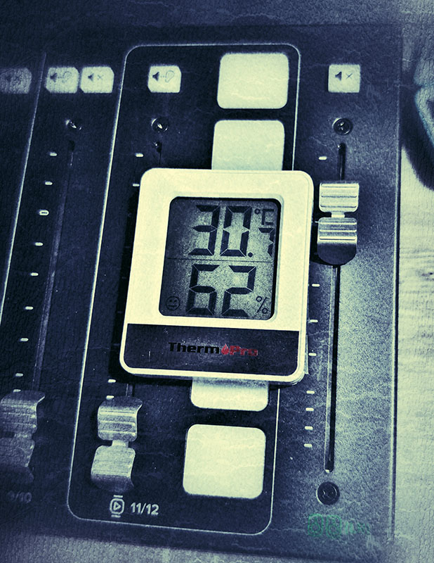 A digital thermometer show 30 degrees centigrade
